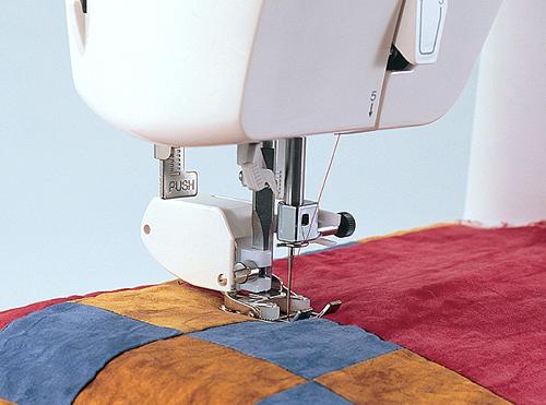 Walking_foot_for_vertical_machines_-_SA169_Brother